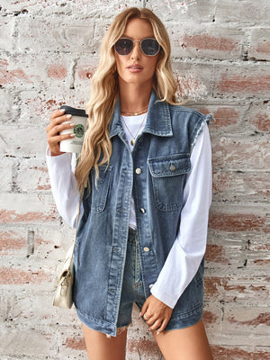 Dusty blue denim utility vest with raw edges, button front, and chest pockets.