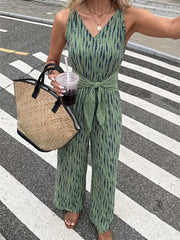 Green abstract print wide-leg jumpsuit with tie waist and V-neck