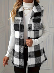 Textured black and white buffalo check vest jacket with button front and collar.