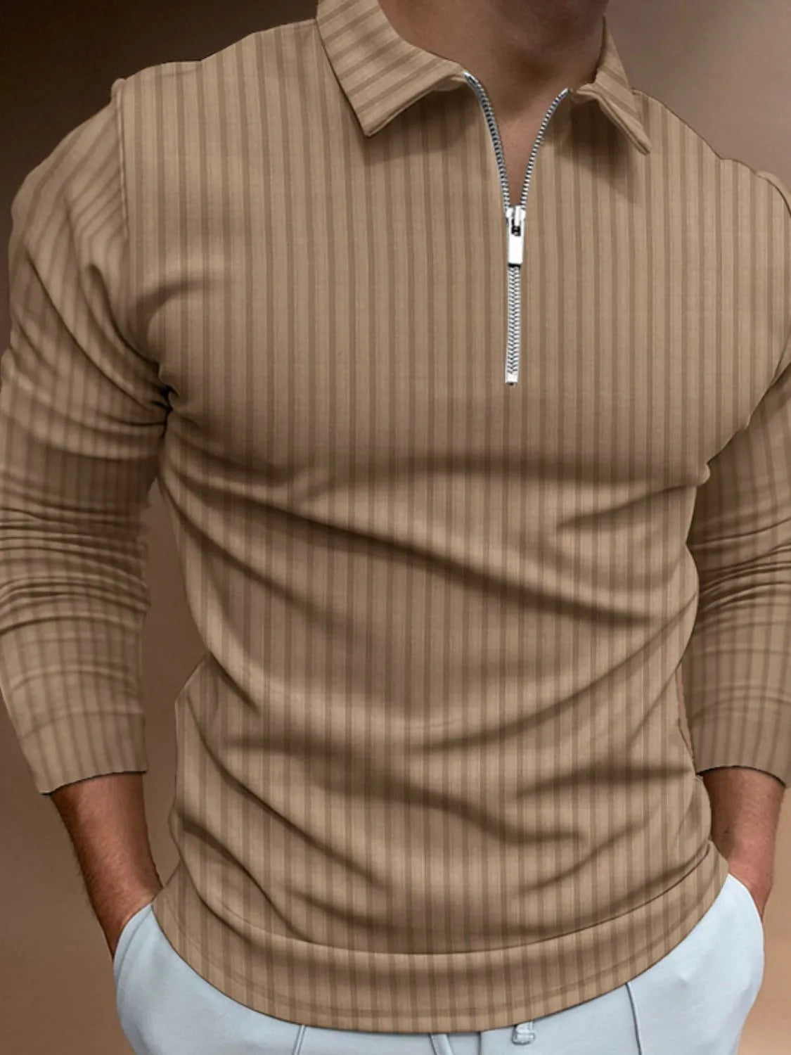 Taupe textured zip-neck polo shirt with vertical stripes and long sleeves.