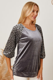Velvet raglan top in dark gray with leopard print 3/4 sleeves and scoop neck.