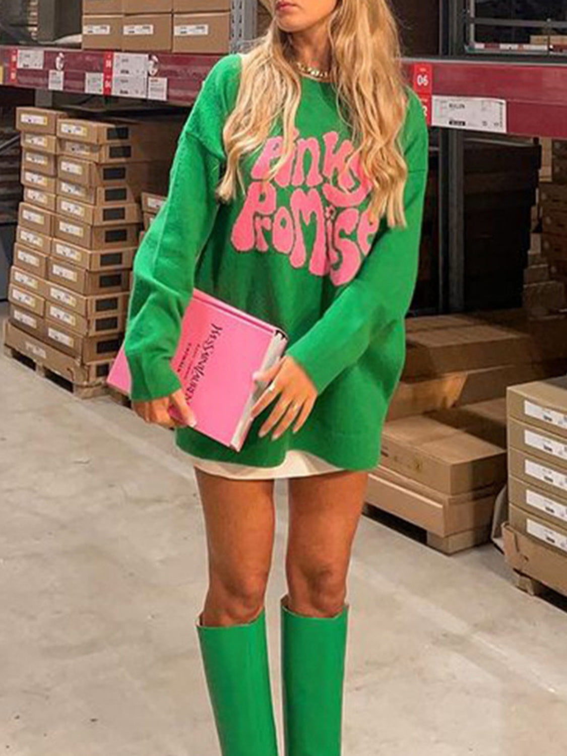 Green graphic knit sweater with pink "Pinky Promise" text, crew neck, long sleeves.
