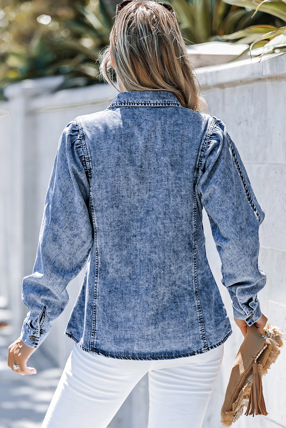 Acid wash denim shirt with puff sleeves and button cuffs, styled casually.