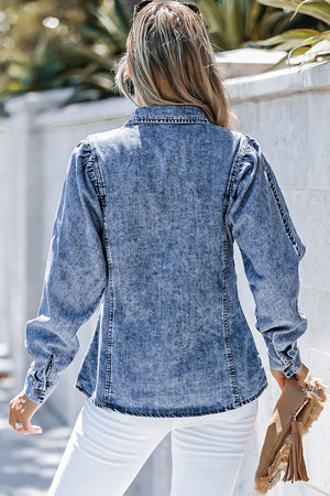 Acid wash denim shirt with puff sleeves and button cuffs, styled casually.