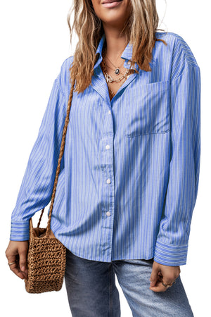 Oversized light blue stripe Oxford shirt with button front and chest pocket.