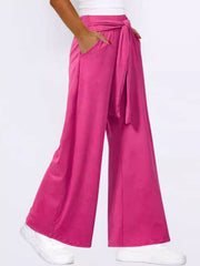 Hot Pink wide-leg flow pants with self-tie waist and pockets.
