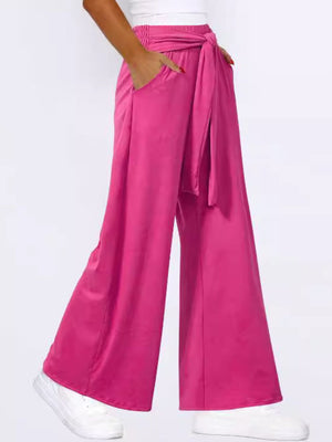 Hot Pink wide-leg flow pants with self-tie waist and pockets.