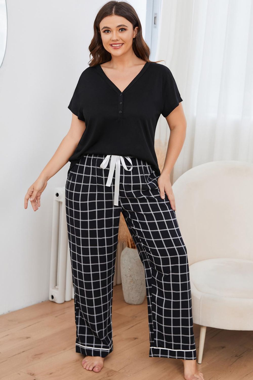 Black grid-print lounge set with Henley top and white drawstring pants