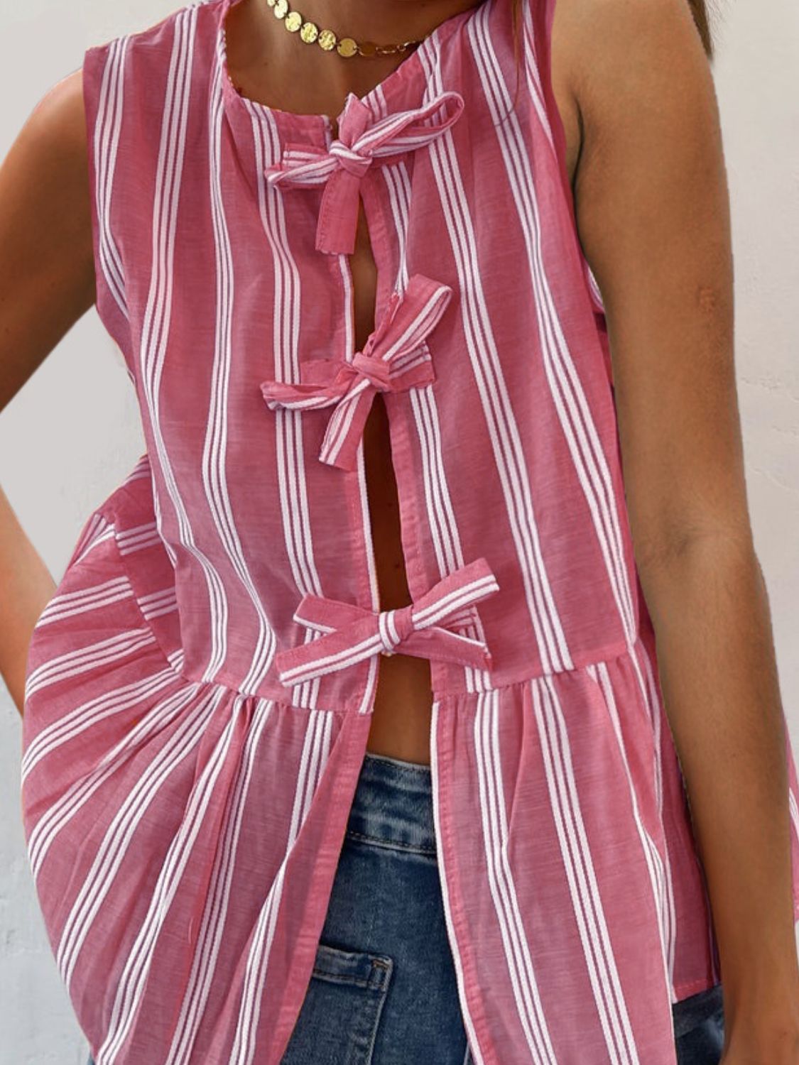 Fuchsia pink striped peplum top with bow tie back detail and open front