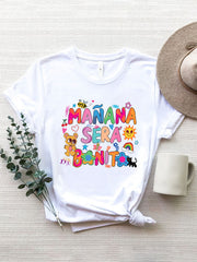 White graphic tee with colorful "Mañana Será Bonito" text and cartoon graphics.