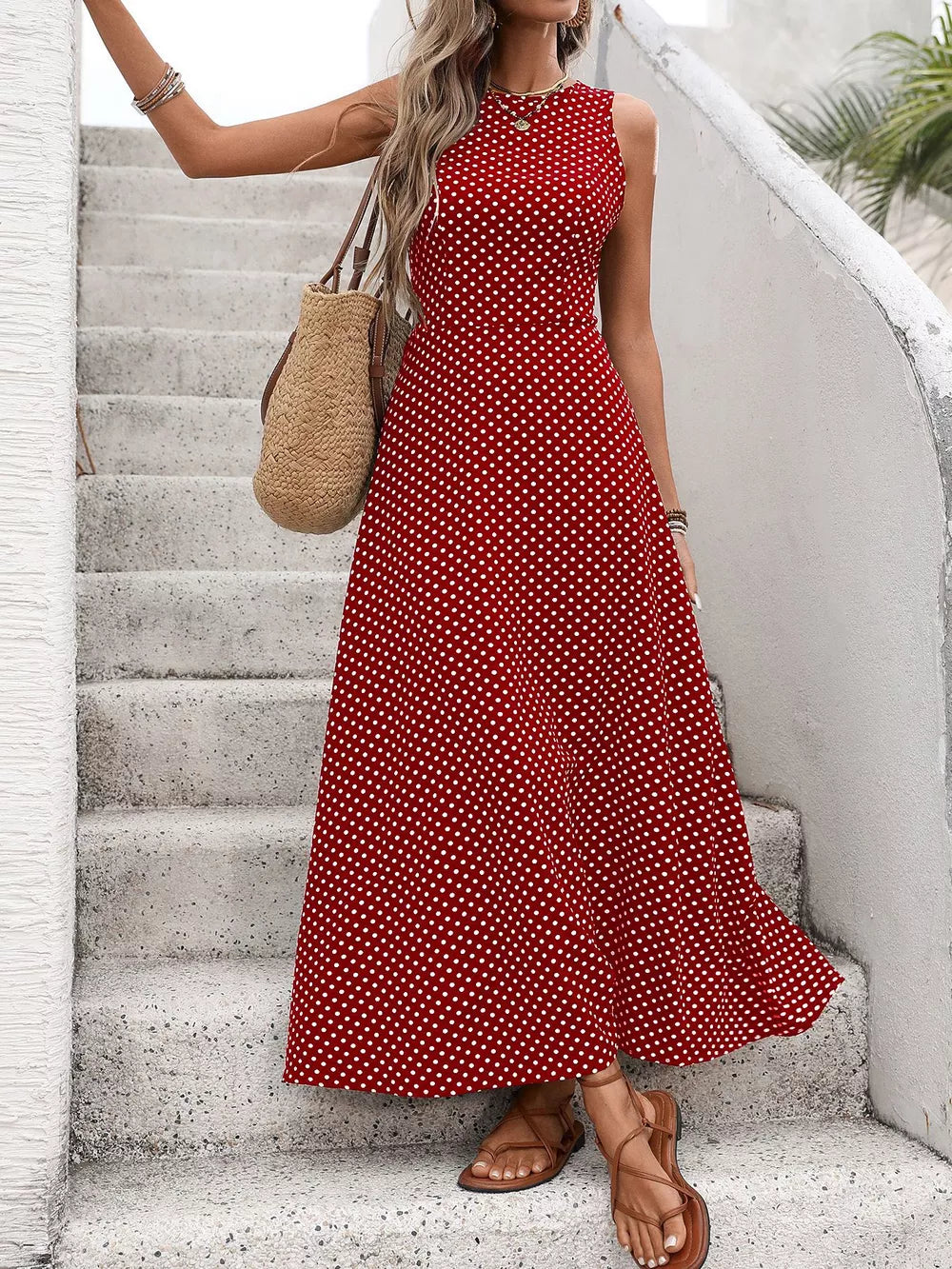 Red polka dot maxi dress with a flattering silhouette and round neckline.