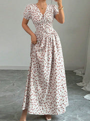 Floral print maxi dress with V-neck, short sleeves, and drawstring waist.