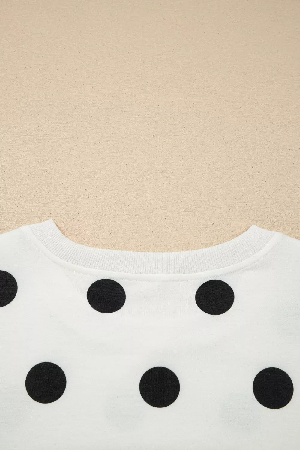 White polka dot two-piece set with ribbed trim neckline