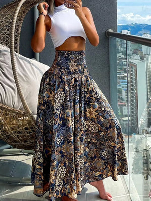 Bohemian print smocked waist maxi pants in dark navy with a floral pattern.