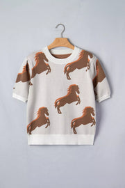 Beige knit sweater with all-over brown horse print and puff sleeves.