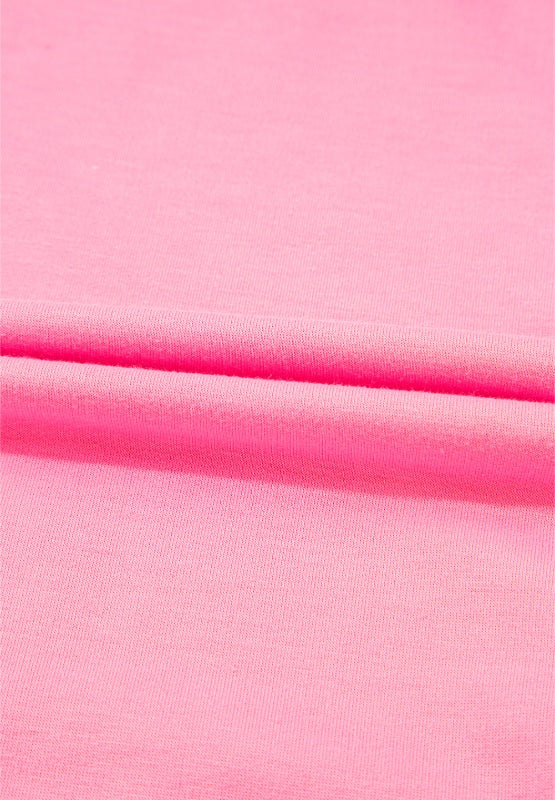 Pink track pants with a soft fabric texture