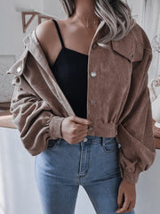 Brown corduroy cropped jacket with balloon sleeves and button-up front.