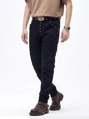 Black cotton slim fit moto jeans with ribbed panels and button fly.