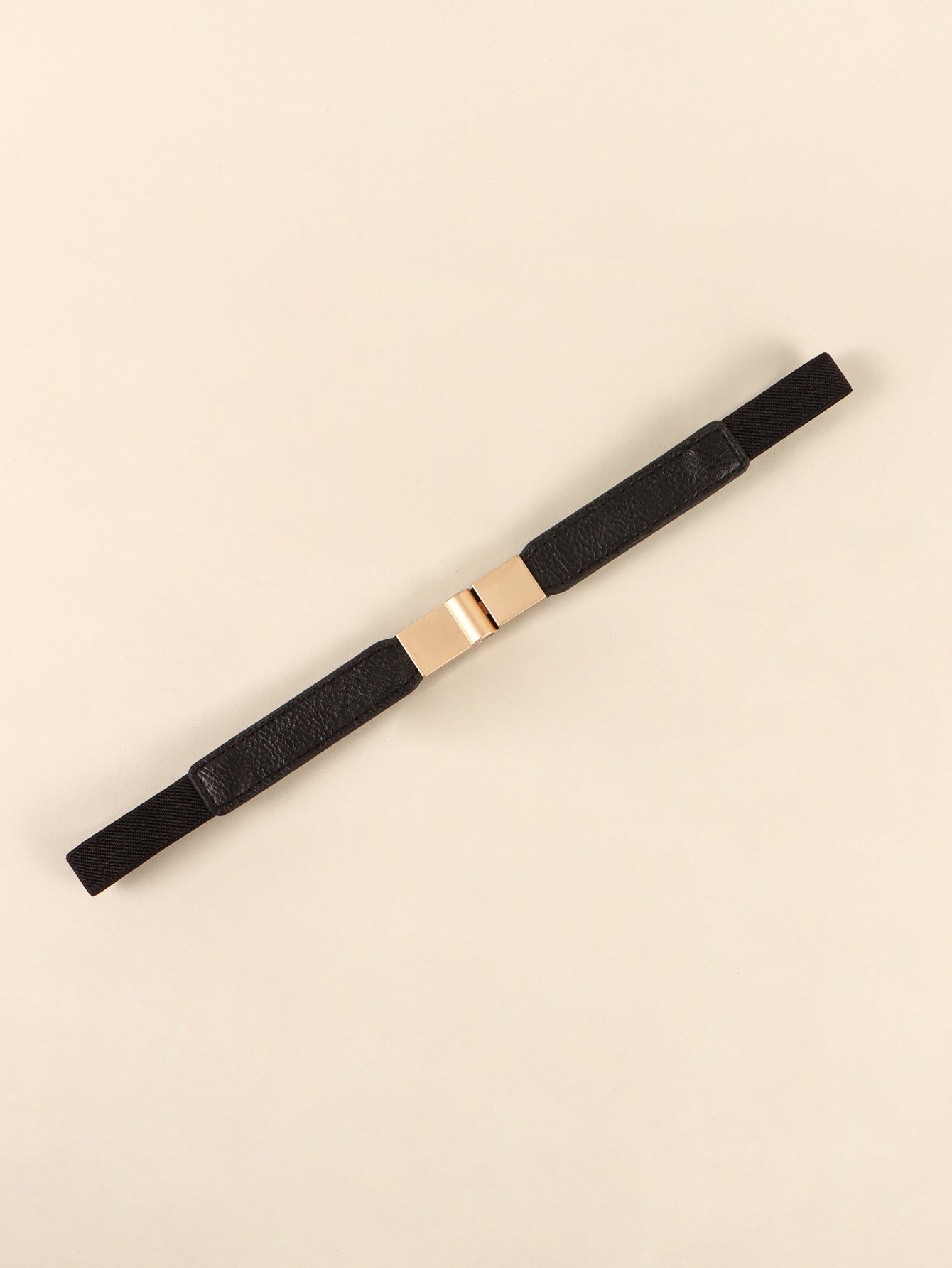Black elasticated belt with leather detail and gold buckle