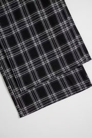 Black plaid palazzo lounge trousers with a comfortable, wide-leg fit.