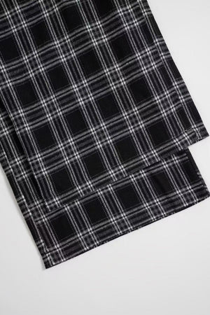 Black plaid palazzo lounge trousers with a comfortable, wide-leg fit.