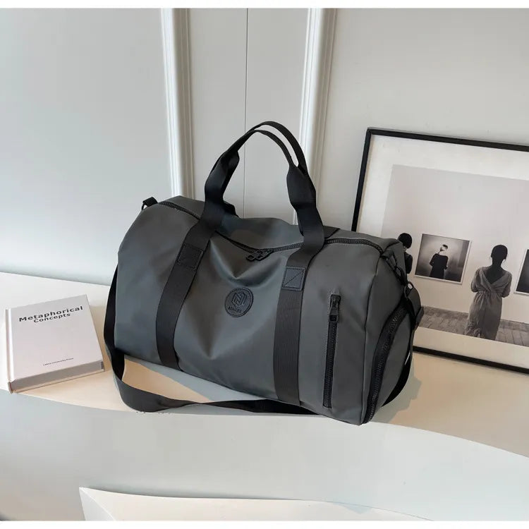 Dark Gray duffel bag with contrast straps and zippered pockets, perfect for gym or travel.