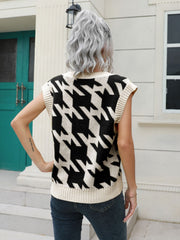 Houndstooth knit v-neck pullover vest in black and cream acrylic, sleeveless, ribbed trim