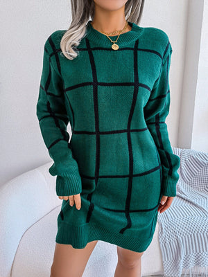 Dark green geometric grid knit mini dress with long sleeves and crew neck.