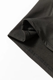 Black thermal top with brushed interior detail and visible stitching.
