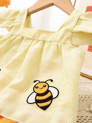 Yellow gingham baby top with ruffled sleeves and bee embroidery.