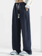 Men's navy blue relaxed fit sweatpants with drawstring waist and pockets.