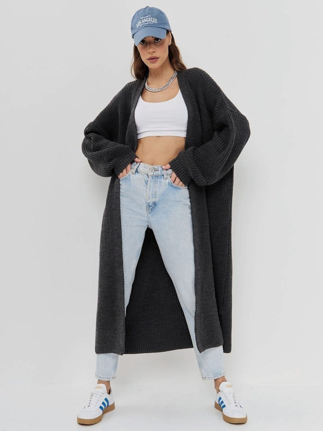 Oversized charcoal gray ribbed knit maxi cardigan with open front and balloon sleeves.