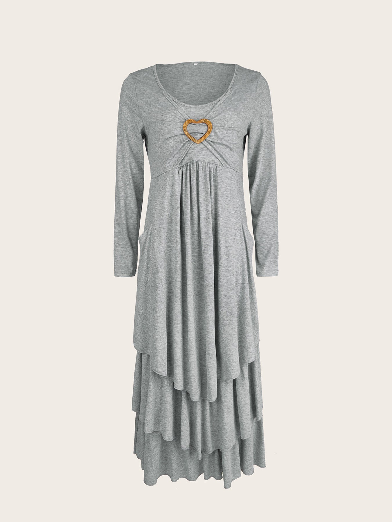 Light gray long sleeve midi dress with tiered hem and heart detail at neckline.