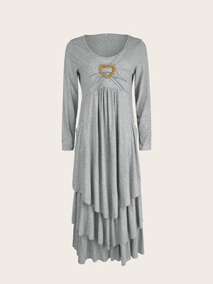 Light gray long sleeve midi dress with tiered hem and heart detail at neckline.