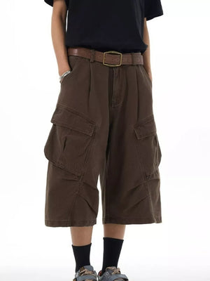 Relaxed chocolate cargo capris with multiple pockets and a brown belt.