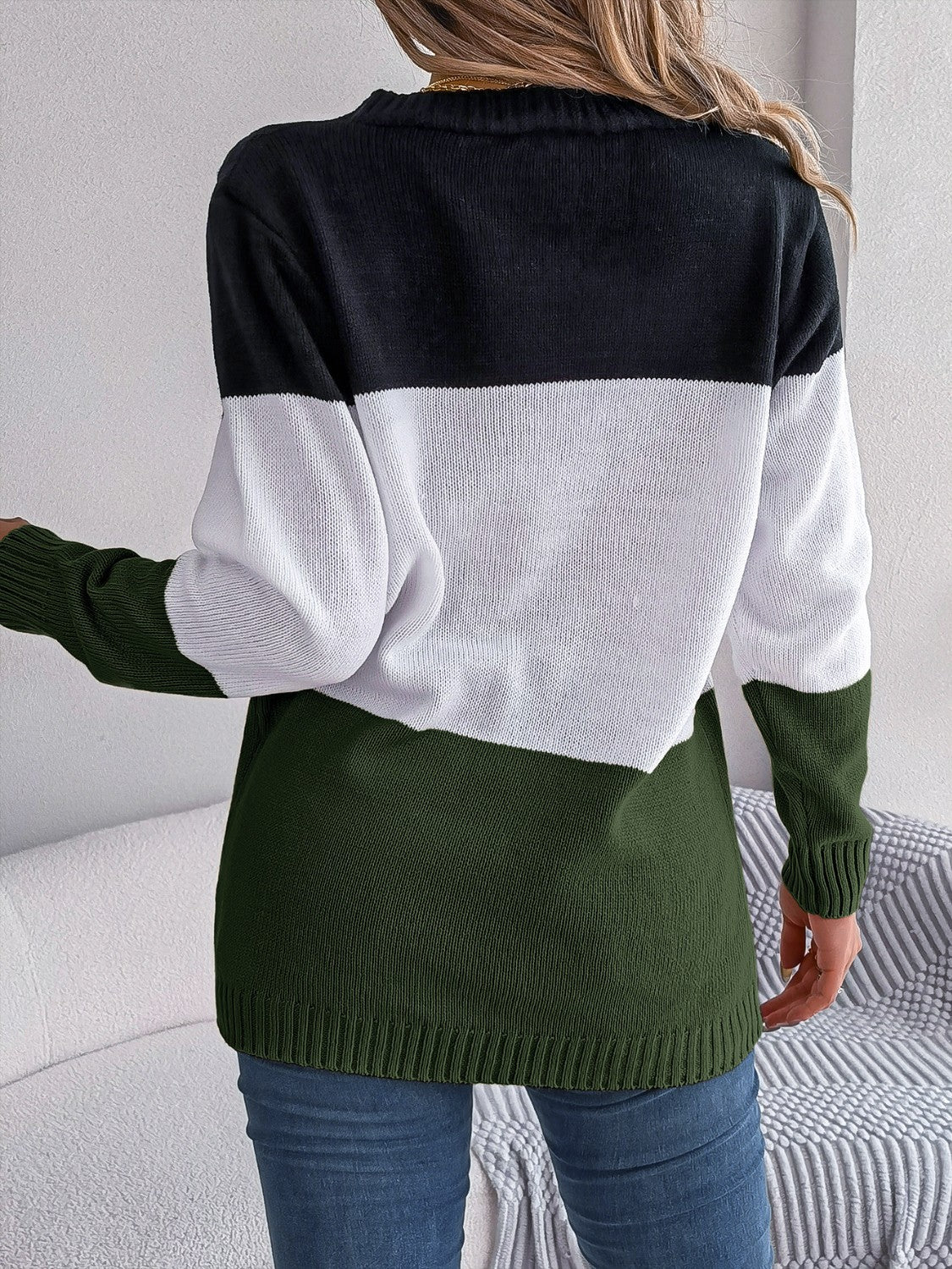 Colorblock cable knit cardigan in acrylic with black, white, and army green stripes.