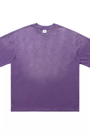 Men's purple oversized vintage t-shirt with a faded wash effect.
