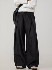 Men's black wide-leg trousers with pleats and a belted waist.