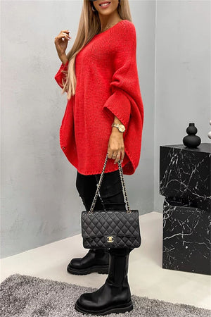 Relaxed knit sweater in Deep Red with cape sleeves and a round neckline.