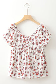 Gathered bust floral puff sleeve blouse with a square neckline and short sleeves.