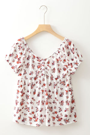 Gathered bust floral puff sleeve blouse with a square neckline and short sleeves.