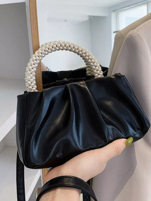 Black mini crossbody bag with ruched faux leather and pearl handle