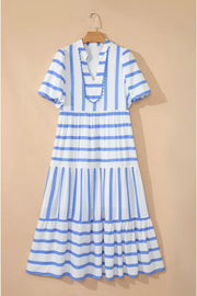 Tiered maxi dress with blue and white stripes, V-neck, short sleeves, and ricrac trim.