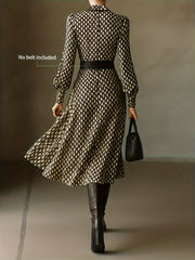 Geometric print midi dress with collar and long sleeves, brown and cream pattern.