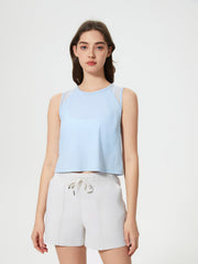 Light blue cropped active tank top with mesh shoulder insets.