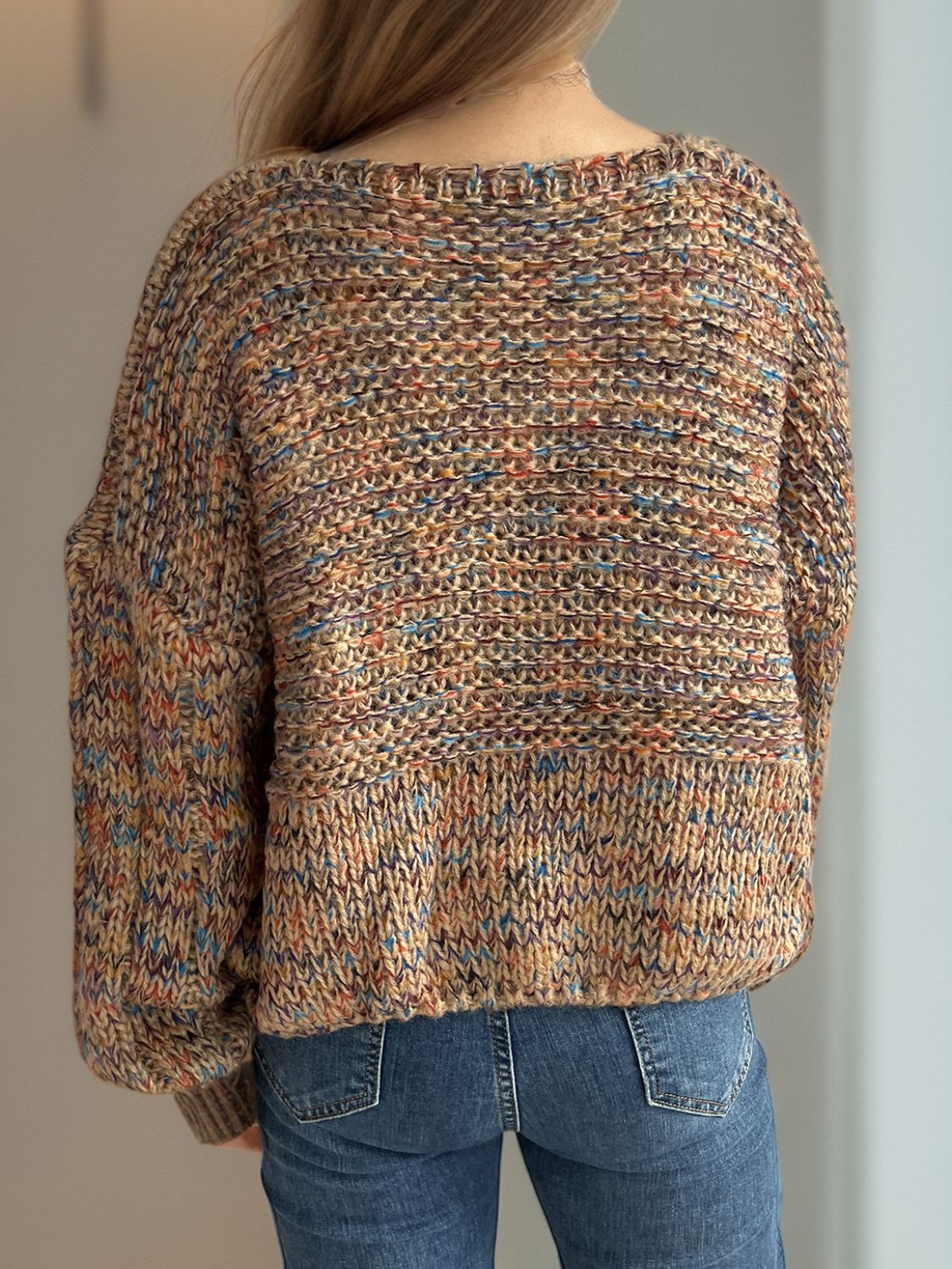 Textured knit sweater with balloon sleeves in a multicolor yarn.