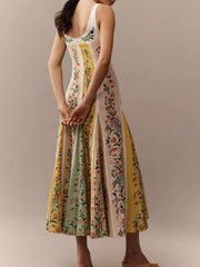 Botanical print sweetheart maxi dress with sweetheart neckline and paneled skirt in cotton.