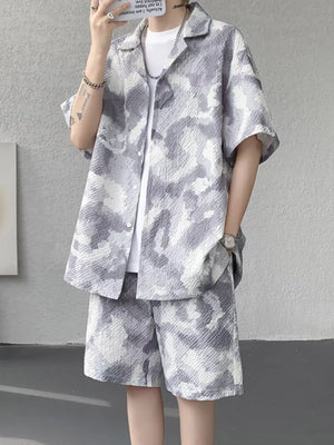 Men's casual camouflage shirt and shorts set in dark gray with a textured pattern.