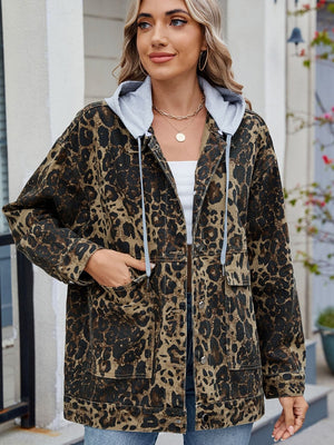 Leopard print denim jacket with a removable grey hooded lining and utility pockets.