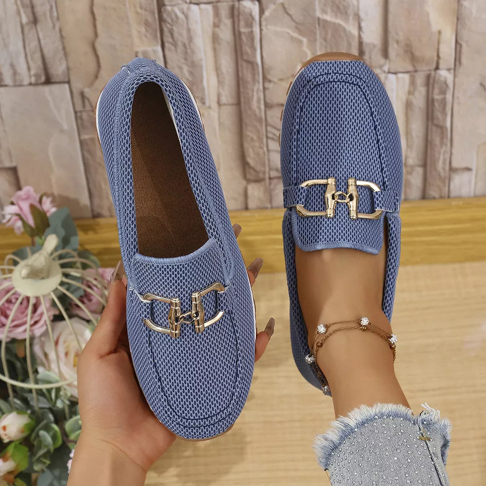 Blue mesh slip-on loafers with gold buckle detail, casual breathable flats.